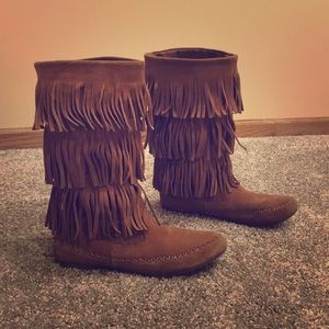 Chestnut colored moccasin boots.
